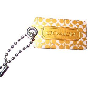 COACH Signature C Orange Metal Hangtag bag charm